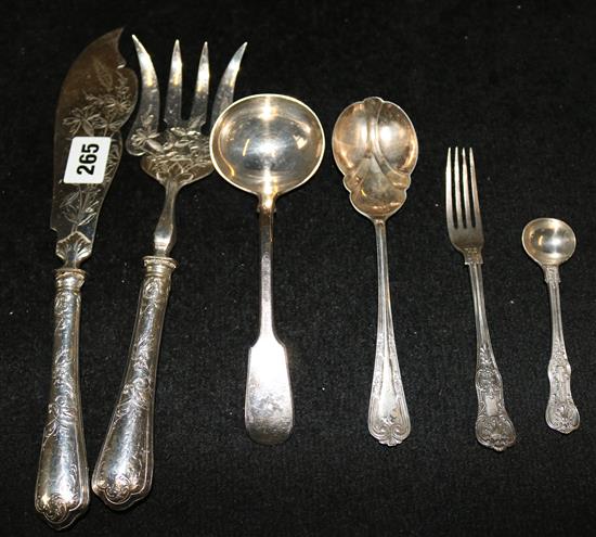 A pair of silver handled fish servers, a Victorian silver sauce ladle, a fork & 2 others